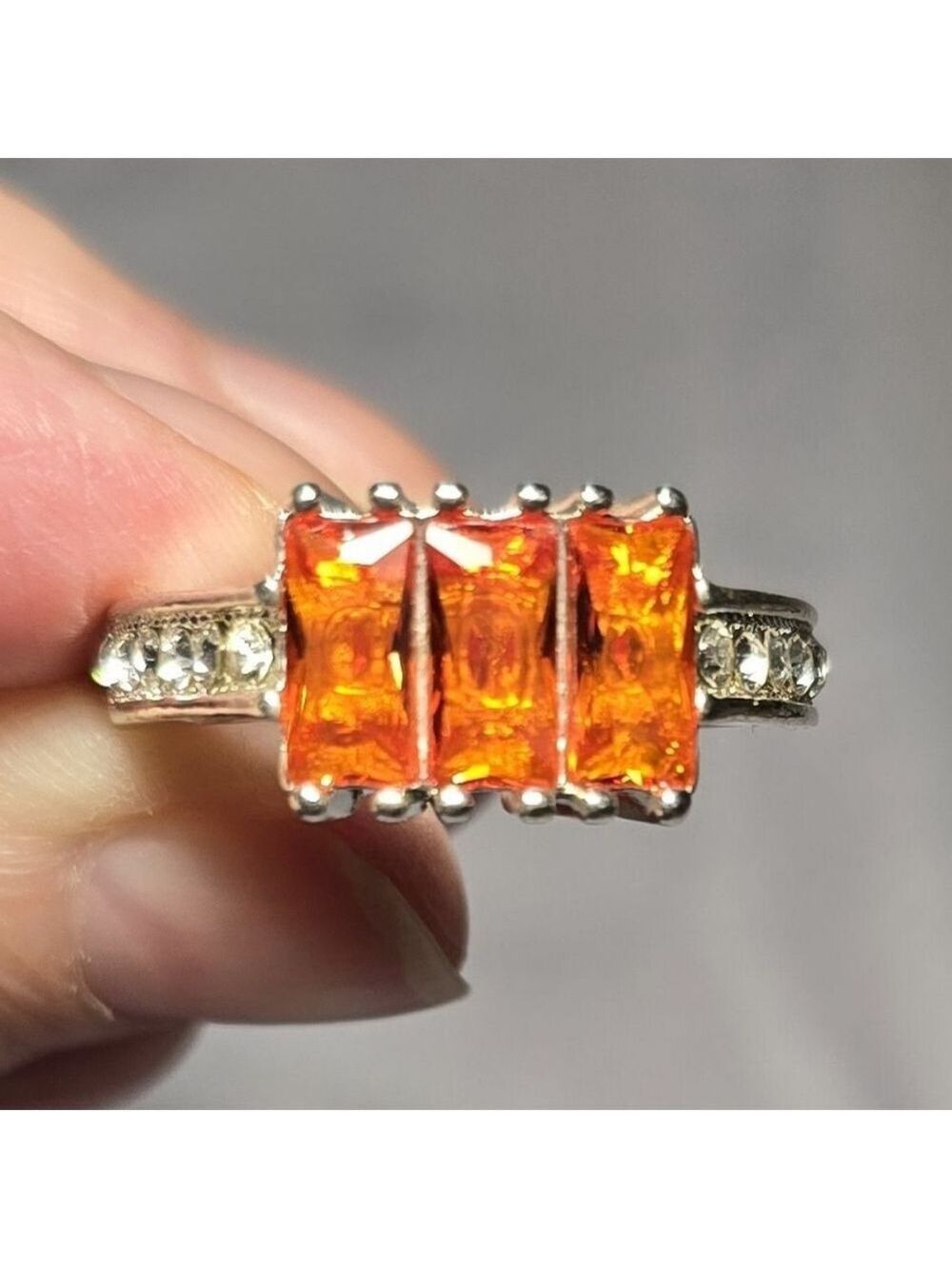 Elegant Silver Ring with Orange Gemstones